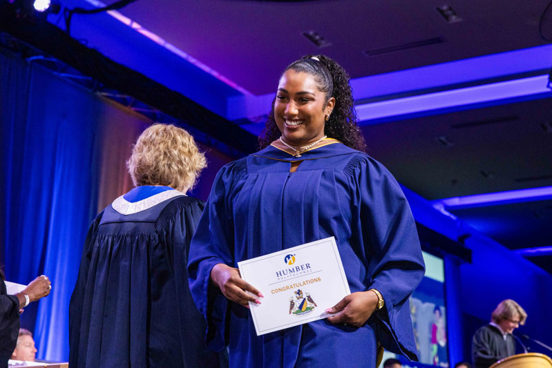 Student holding diploma