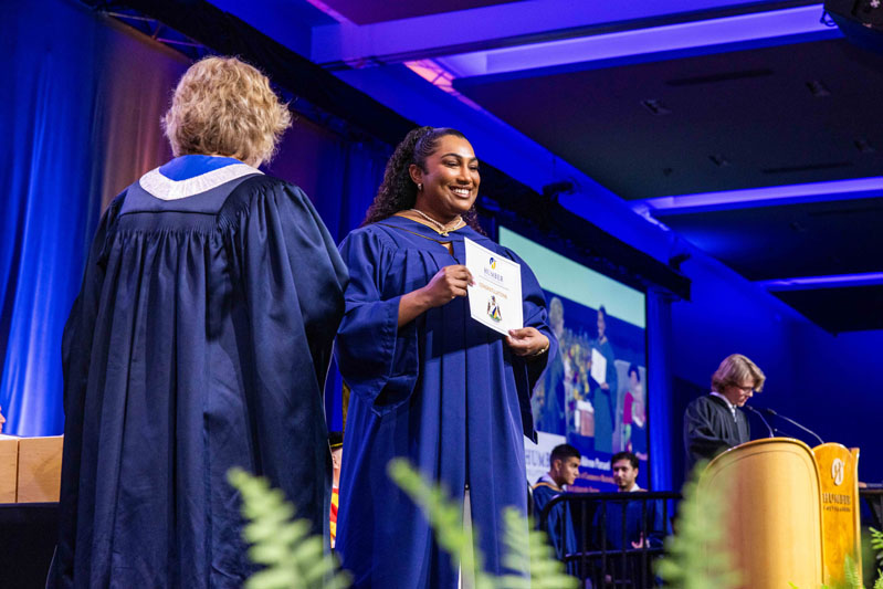 Student holding diploma