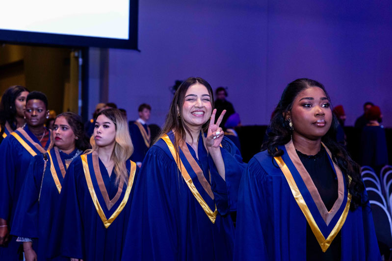 Students smiling in line