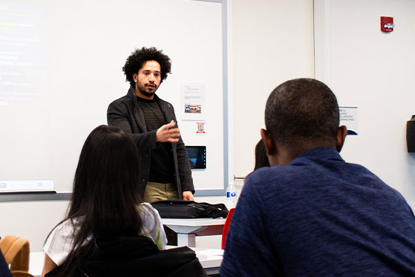 Teacher giving class in an IGS class room