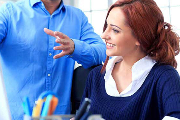 woman smiling at screen