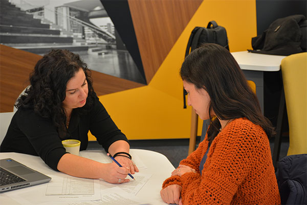 Student and advisor at table