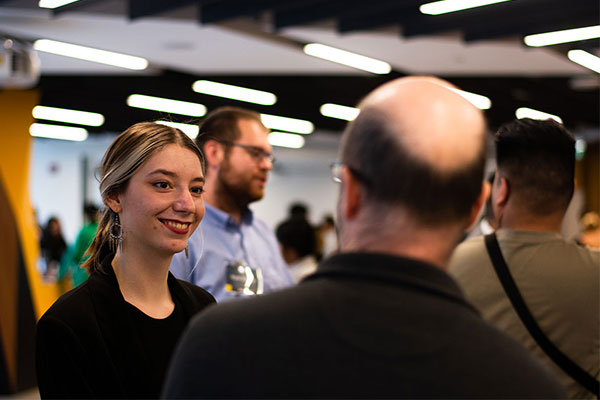 Two people talking at event