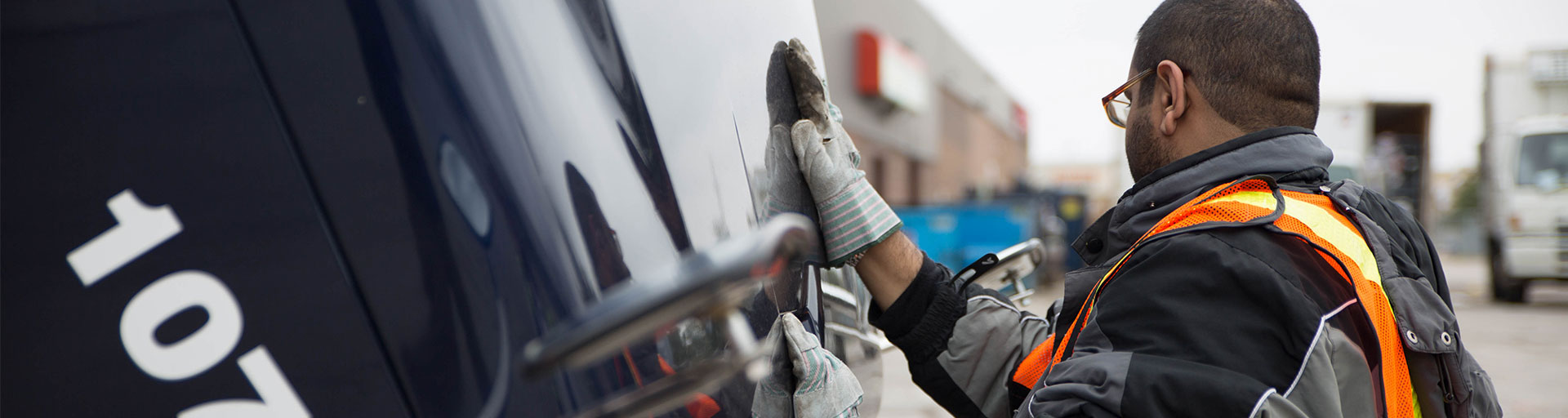 male inspecting a truck