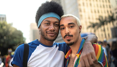 a gay couple side hugging