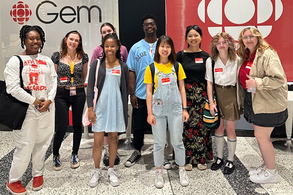 group of people standing together smiling