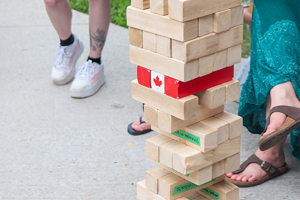 giant jenga with a Canadian flag on one 
