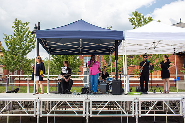 students on a stage with instruments