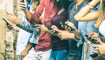 students holding a cell phone