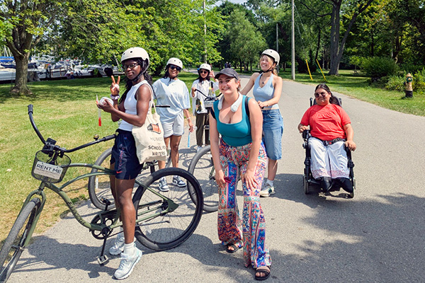 group of people gathered together on bikes