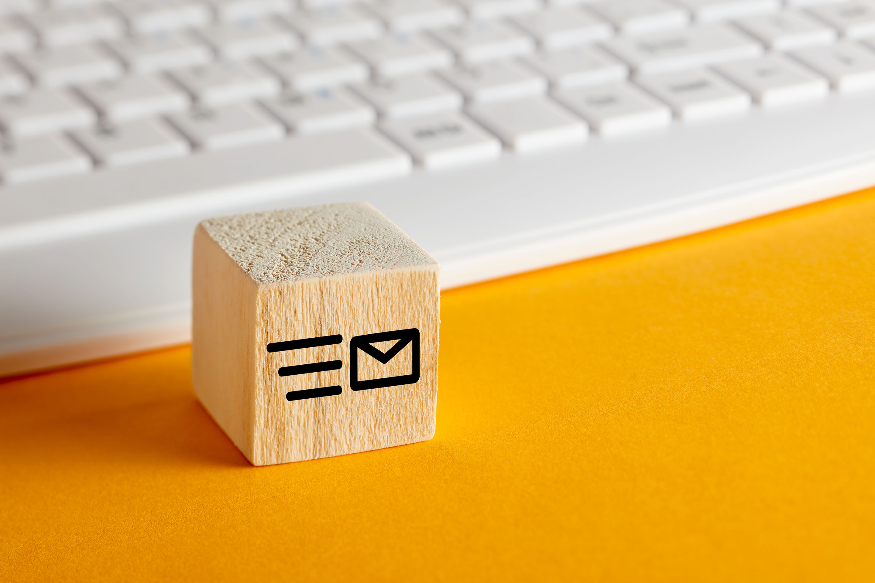Wooden block with an email icon