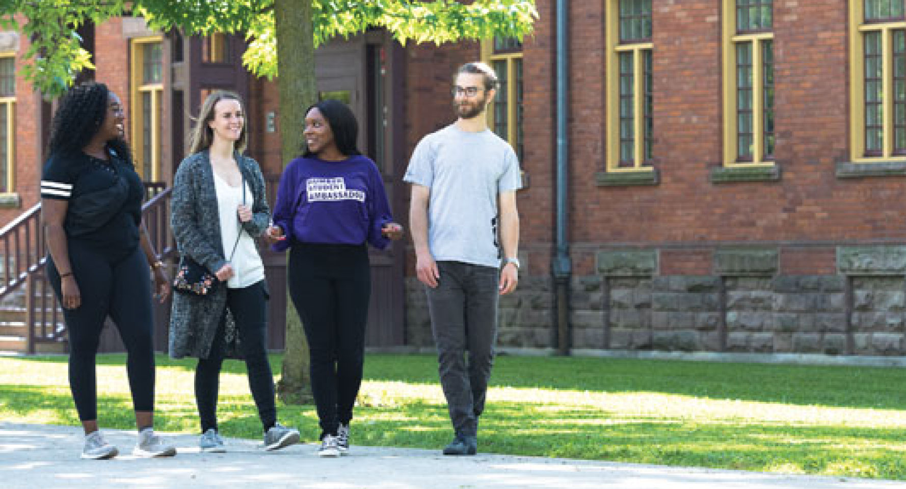 Diverse set of students walking together on a college