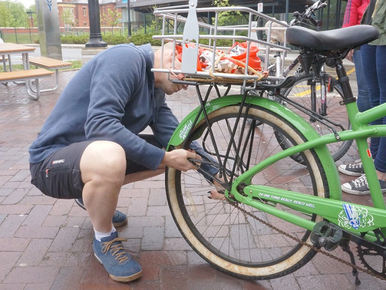 man fixing a bike