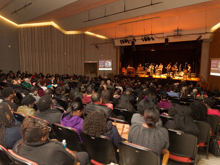 venue with a audience and band performing