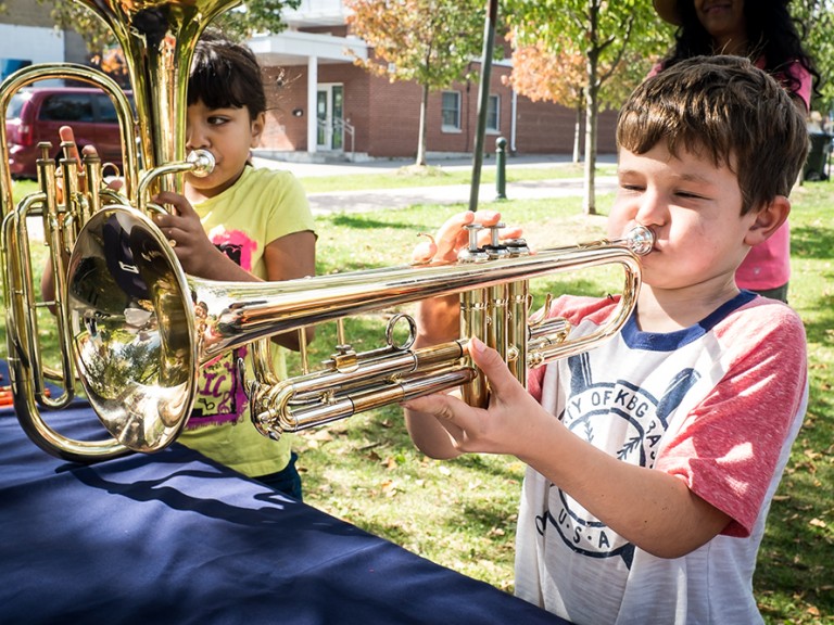 Kid playing the trumpet