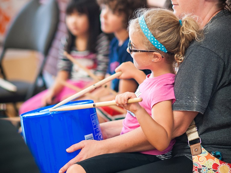 kid playing the drums