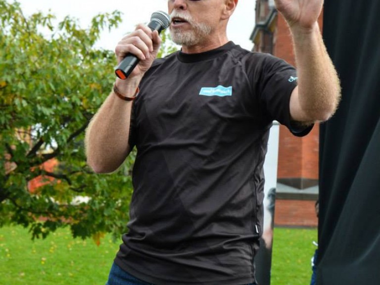 Man speaking into microphone
