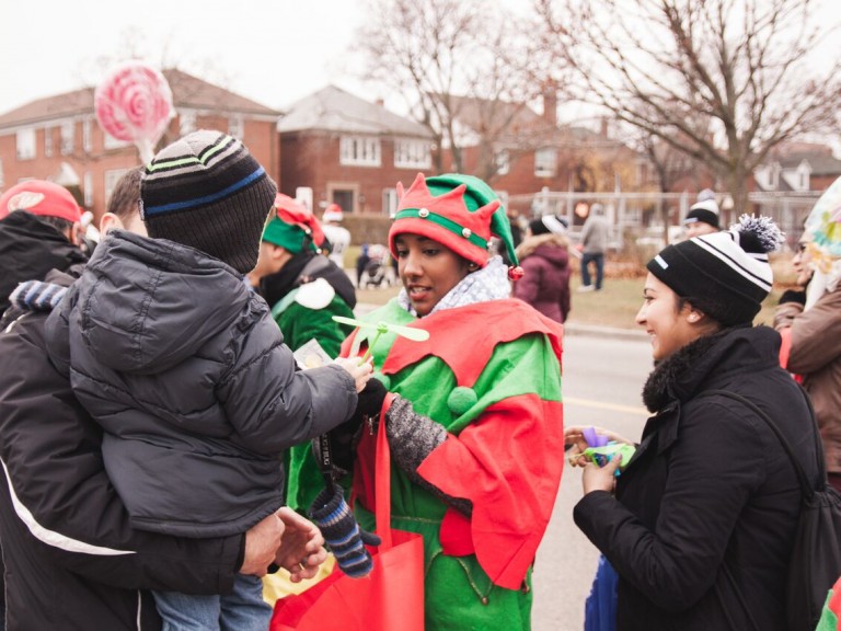 person in elf costume interacting with the crowd