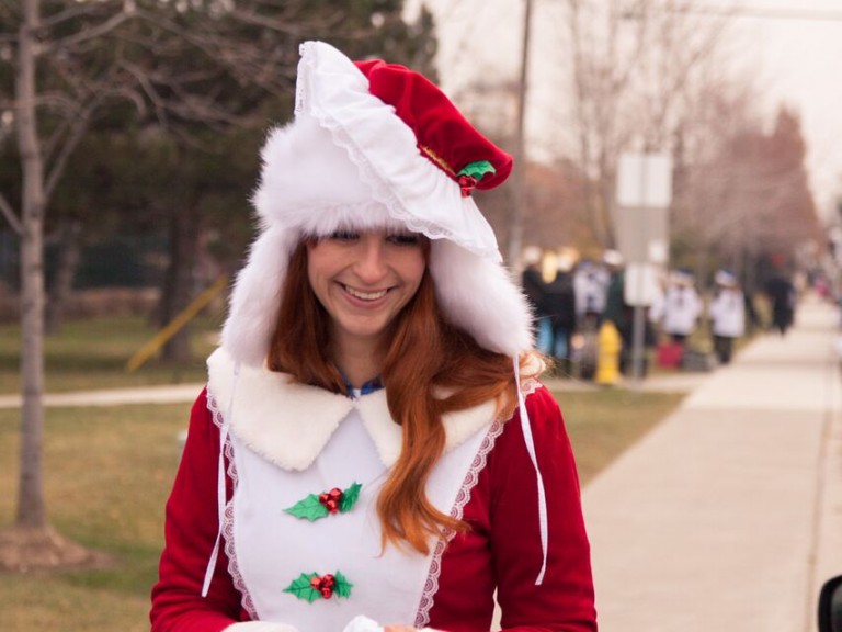 person dresses in Mrs. Clause costume
