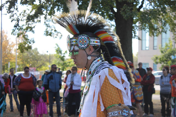 person wearing traditional indigenous clothing