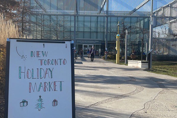 Sign about New Holiday Market in front of Interpretive Centre