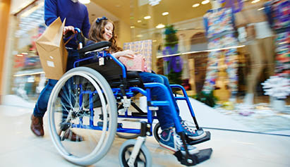 little girl in a wheelchair