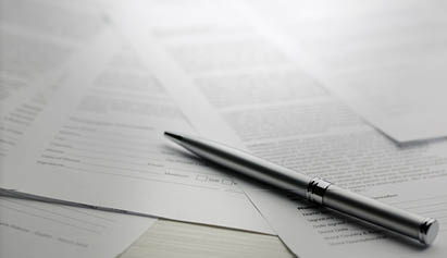 pen laying on top of paper