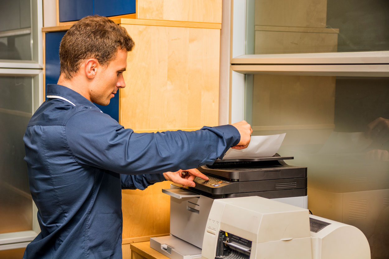 male student using a printer