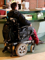 person in a motorized wheelchair