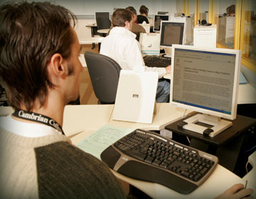 Person sitting at computer desk