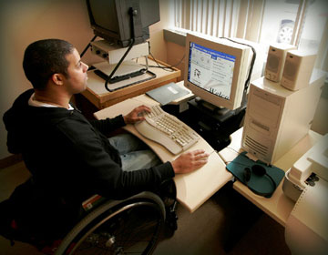 Student in wheelchair at computer