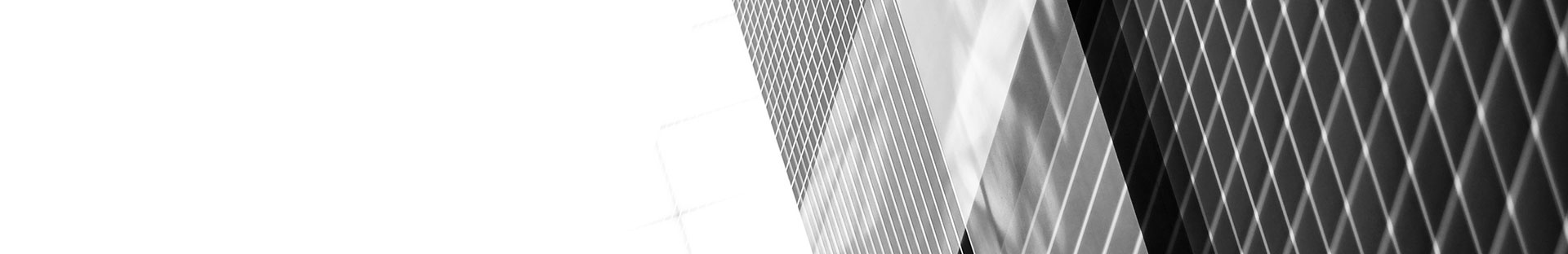 black and white close up of a glass building