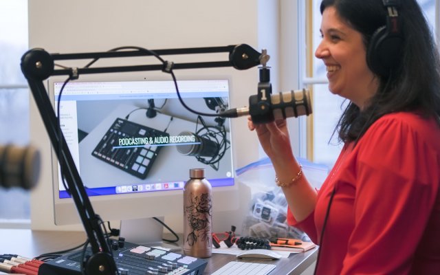 Person talking on microphone