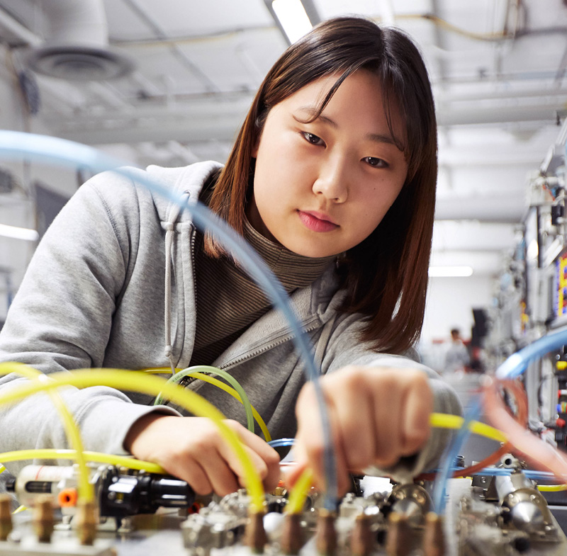 Students working with machine