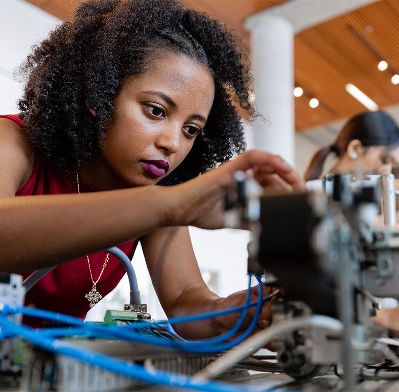 Engineer student working on a piece of equipment