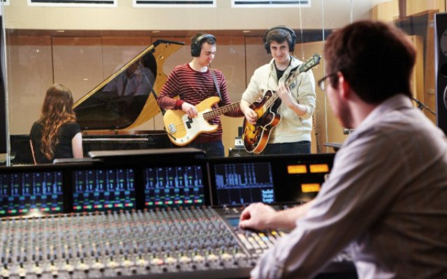recording session - mixing desk, 3 students playing guitars and piano
