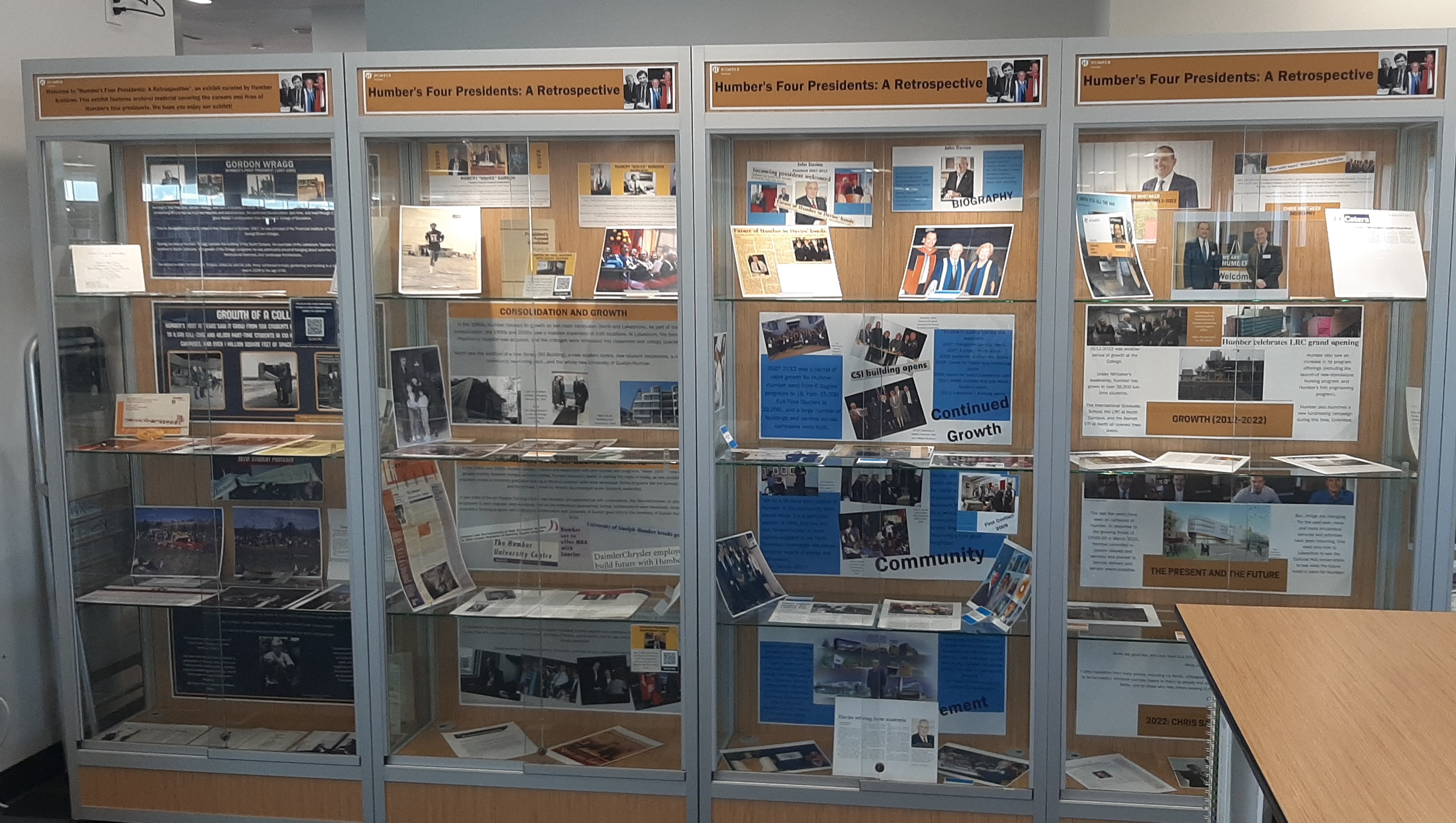 Four display cabinets in the Library full of archival material about Humber's presidents.