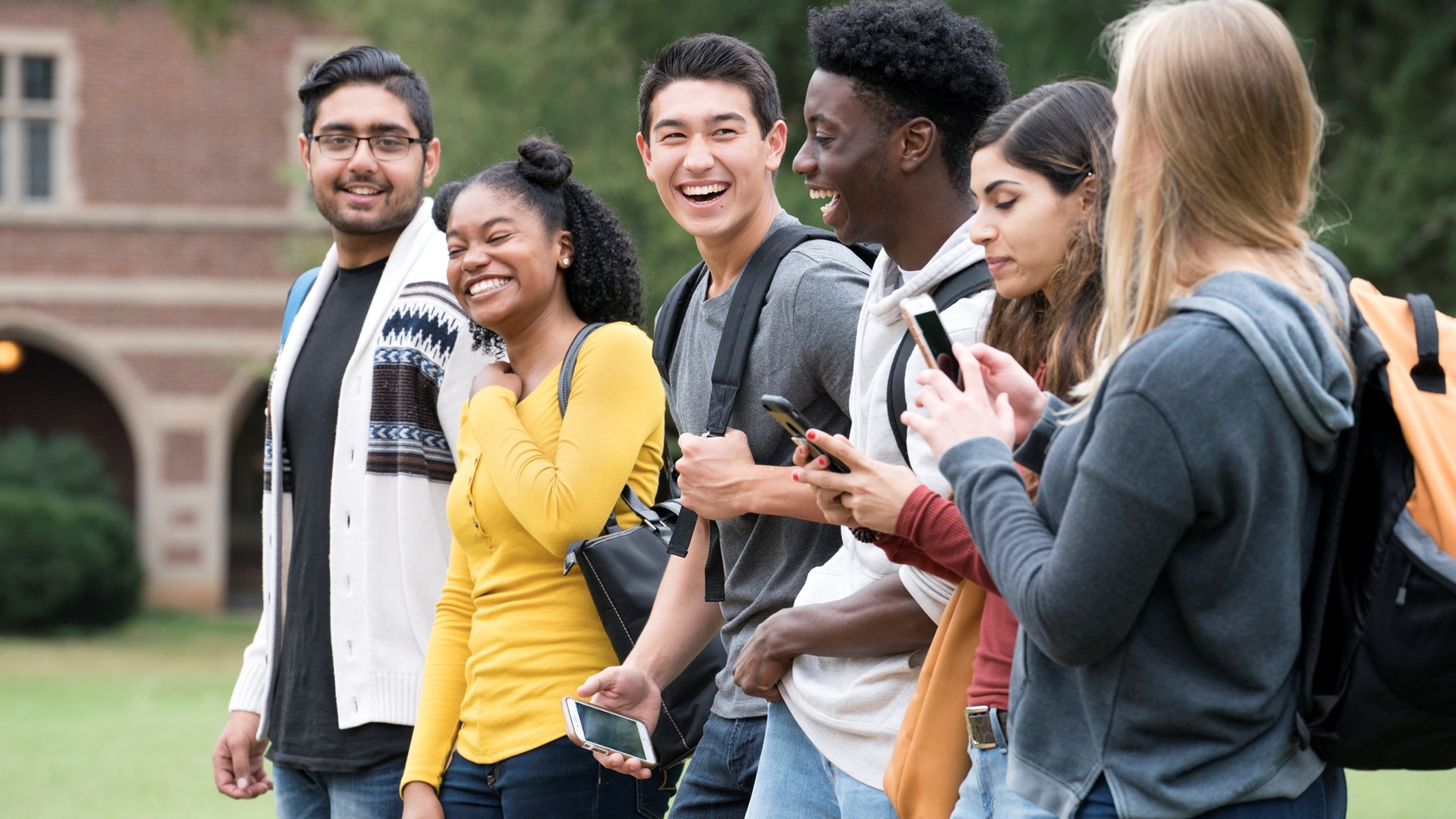 Group of college students walking together outside