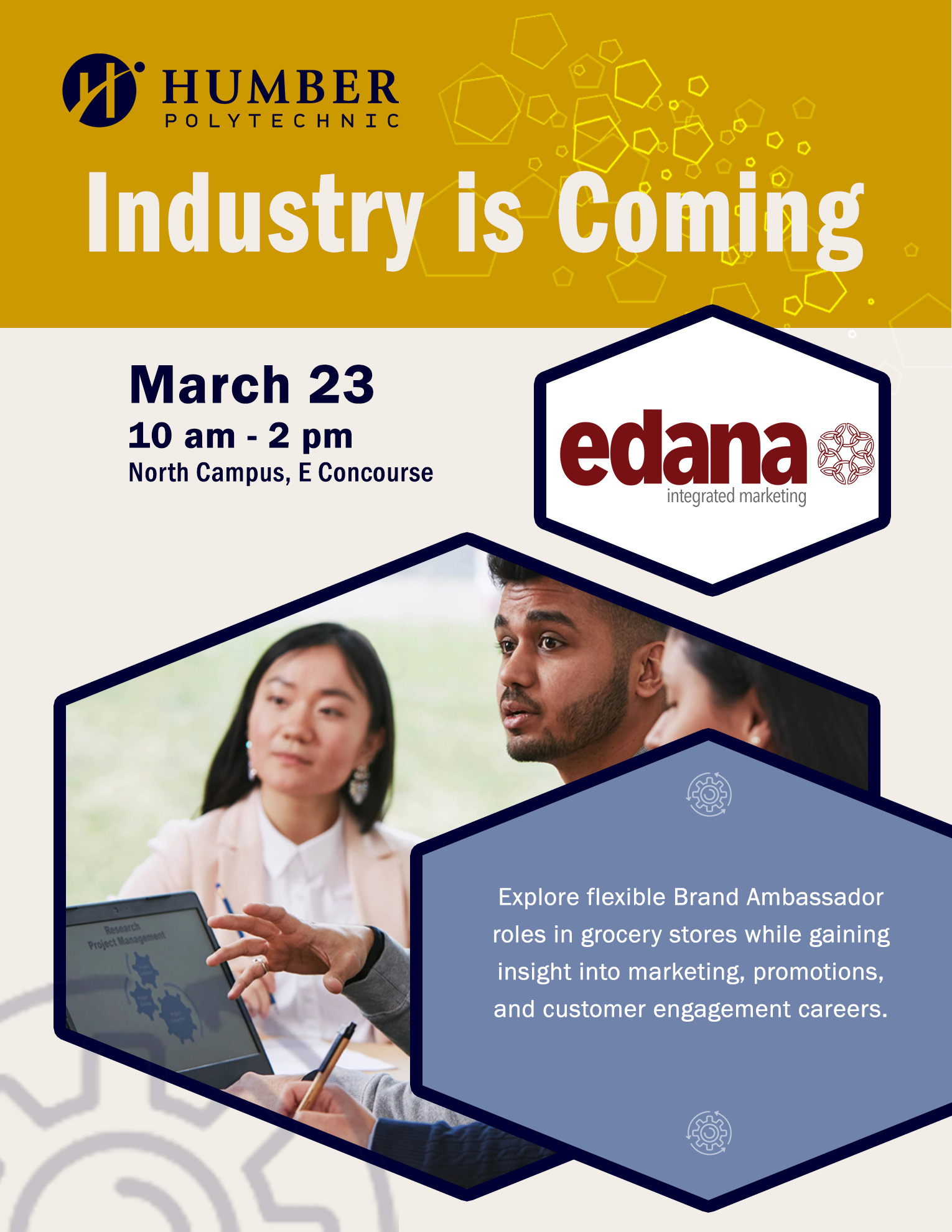 Students sitting in front of a laptop