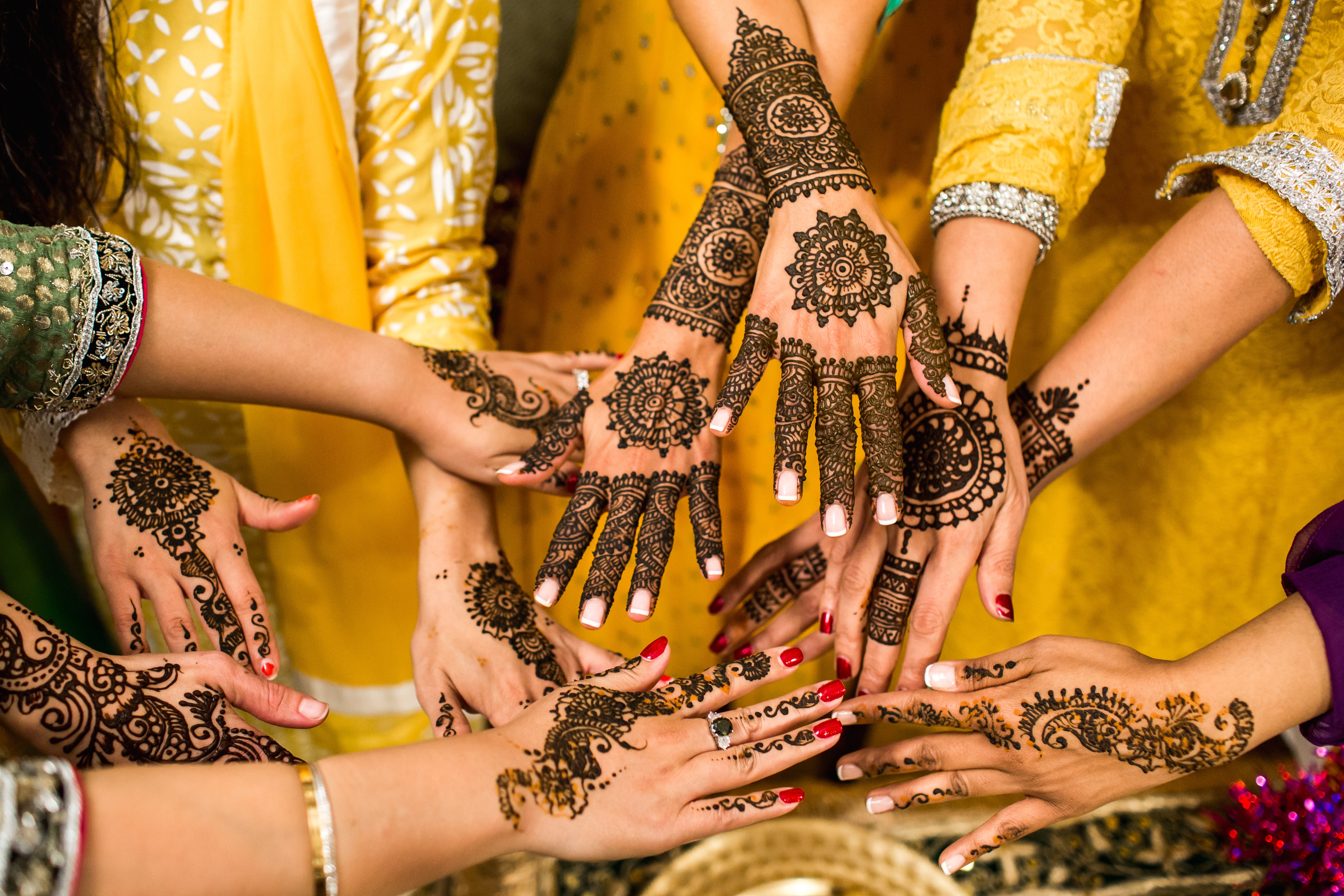 People's hands with henna.