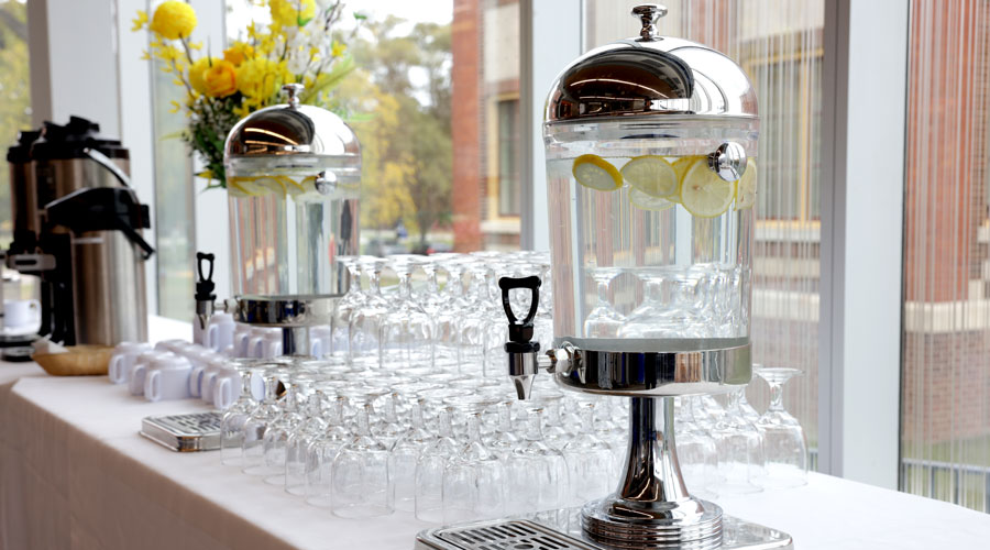 Cups and drink carafes on table at event