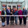 Dignitaries and volunteers cut the ribbon to open the volunteer centre ,