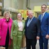 Four smiling people stand together in a learning lab at Humber Polytechnic’s Centre for Skilled Trades and Technology.