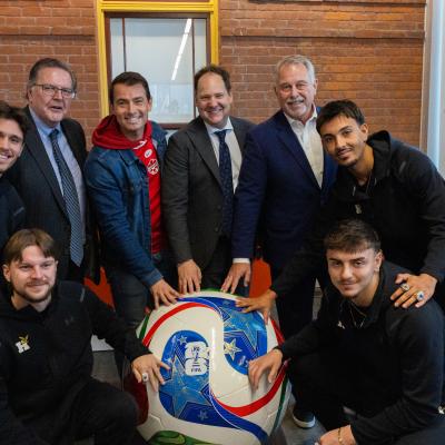 Volunteer Centre Opening with Dignitaries and Humber Hawks Men's Soccer Players. Dignitaries and Humber Men's soccer players pose with giant soccer ball.