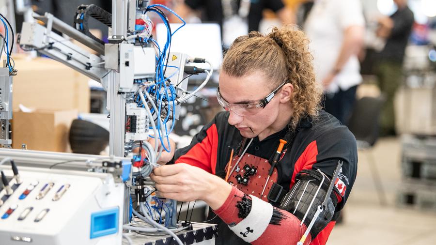 A person is working on a mechanical device.