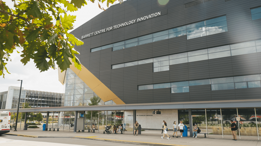 An exterior of a building with a sign on it that reads Barrett Centre for Technology Innovation.