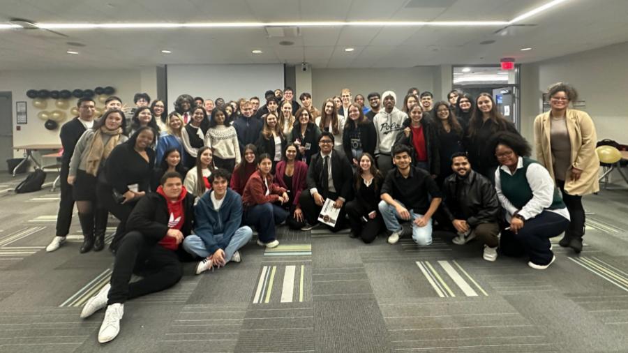 A group of people pose together for a photo.