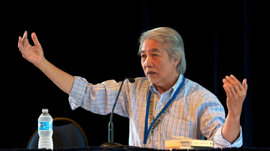 A photo of Wayson Choy delivering a lecture from 2012.