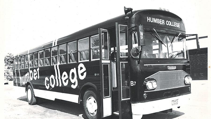 A black-and-white photo of a bus with the words Humber College on it.