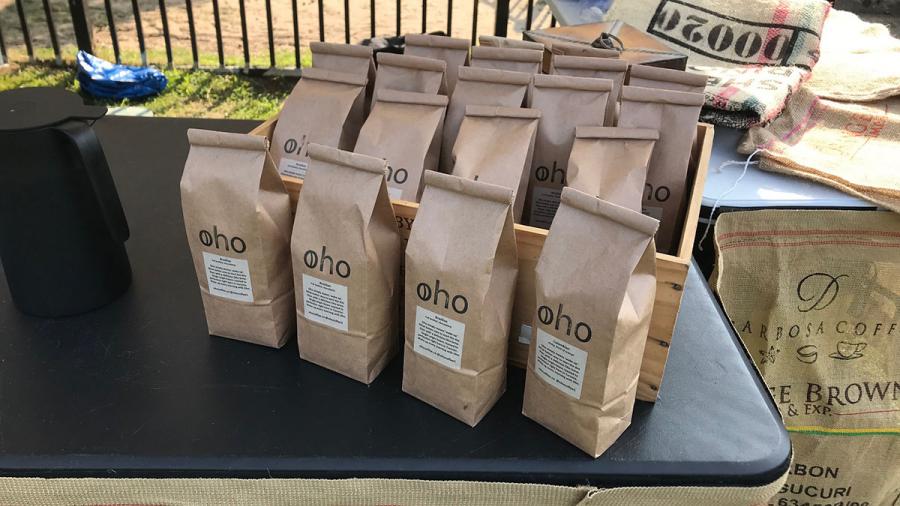 A number of brown paper bags with OHO printed on them.